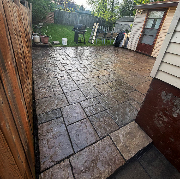 Finished stamped interlock patio installed by Seal-Tech Solutions