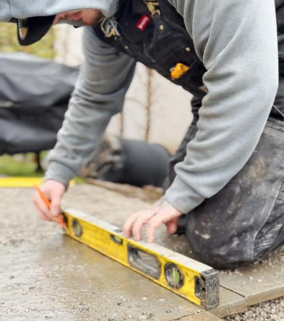 Seal-Tech Solutions crew leveling pavers with precision